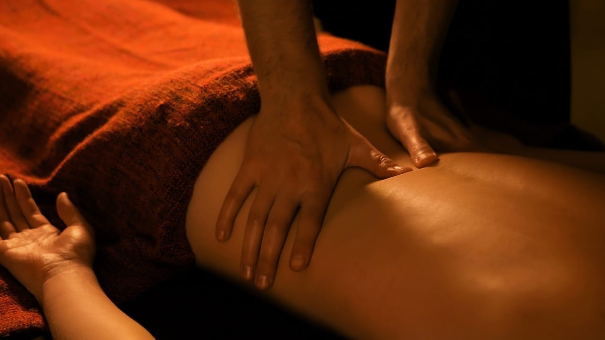 Bali massage therapist with client session