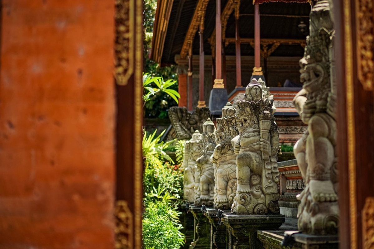 Balinese temple entrance with ornate gates and stone pathways